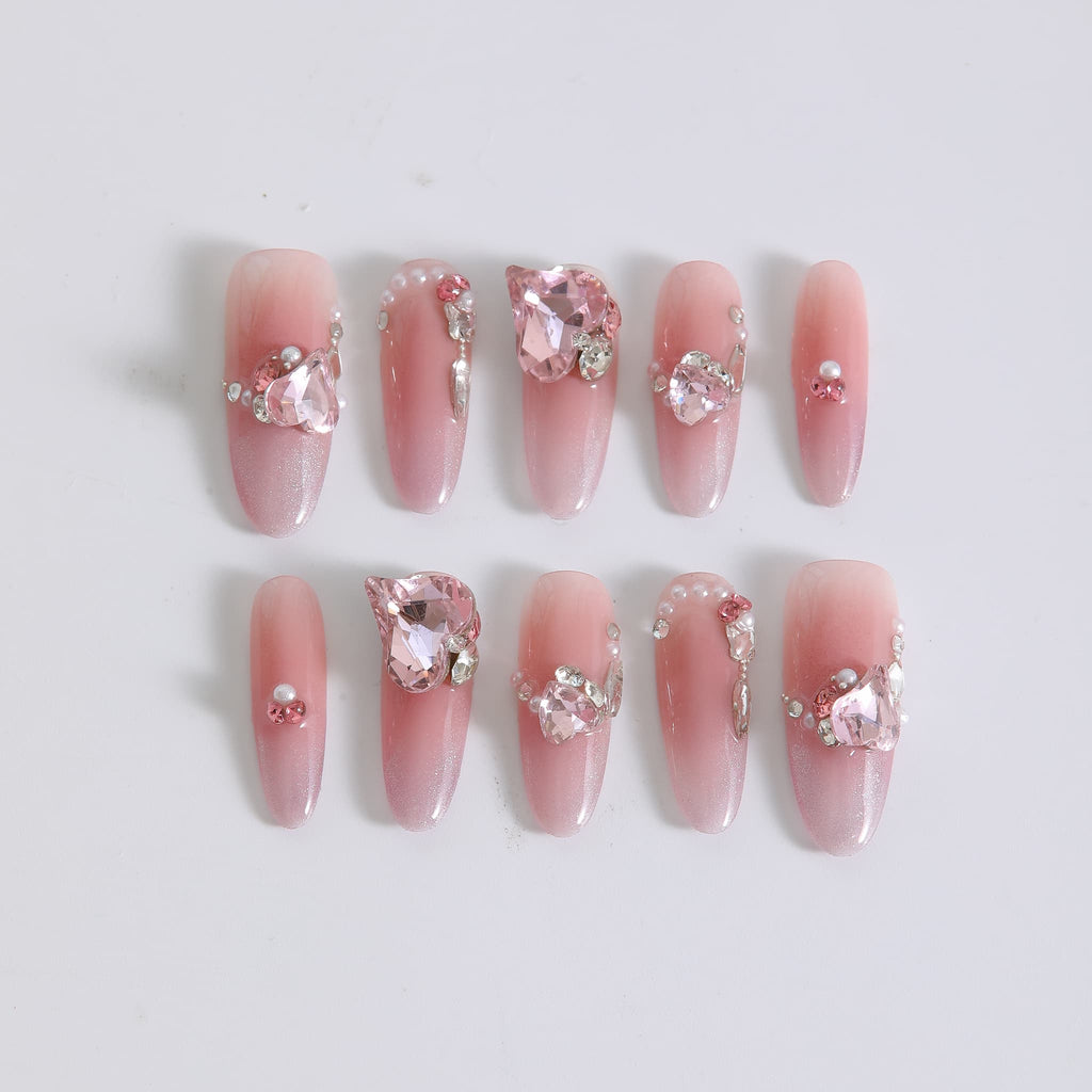 long length light pink oval press on nails with gemstones