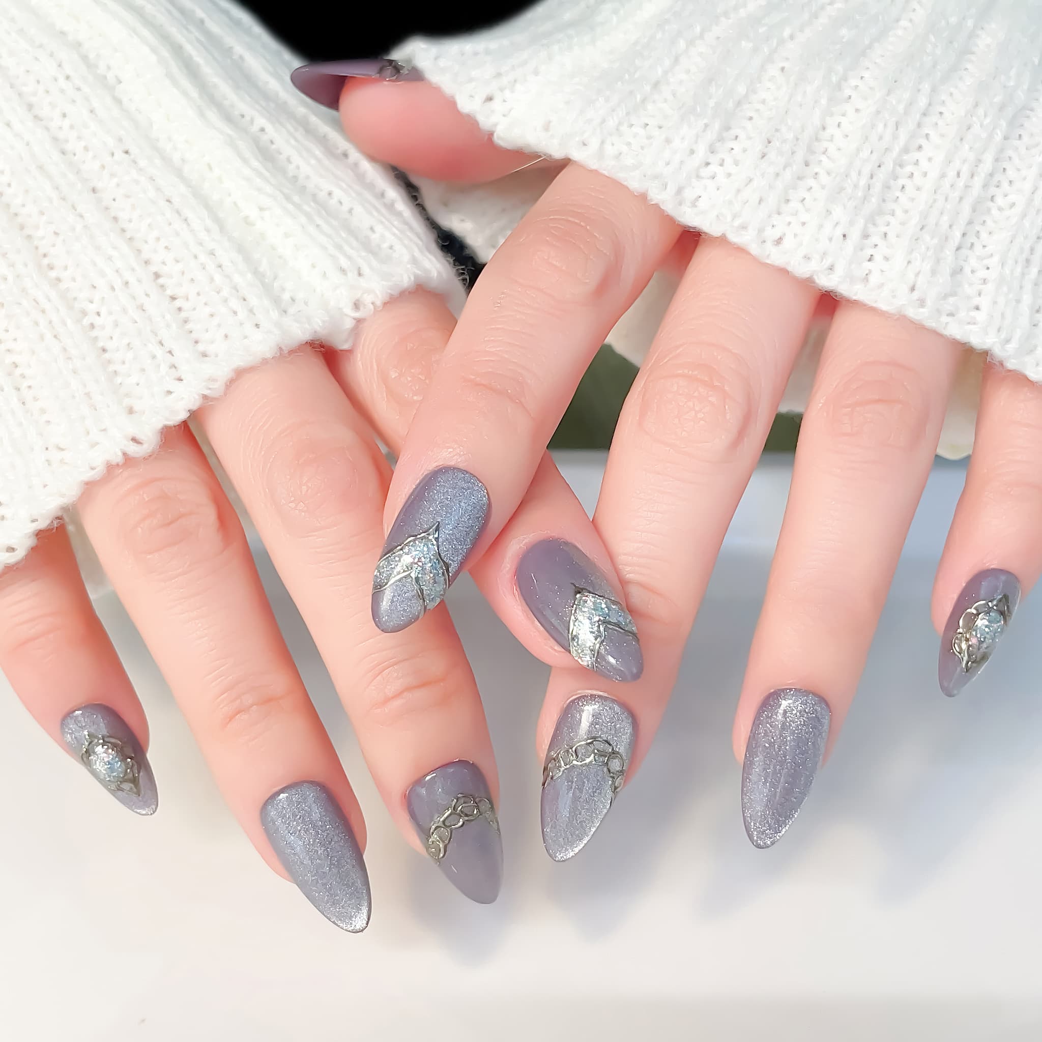 medium length lavender almond press on nails with glitter design