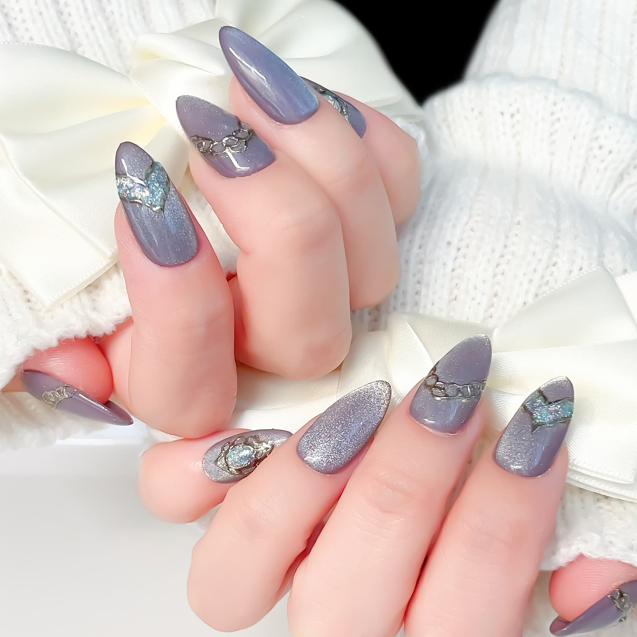 medium length lavender almond press on nails with glitter design