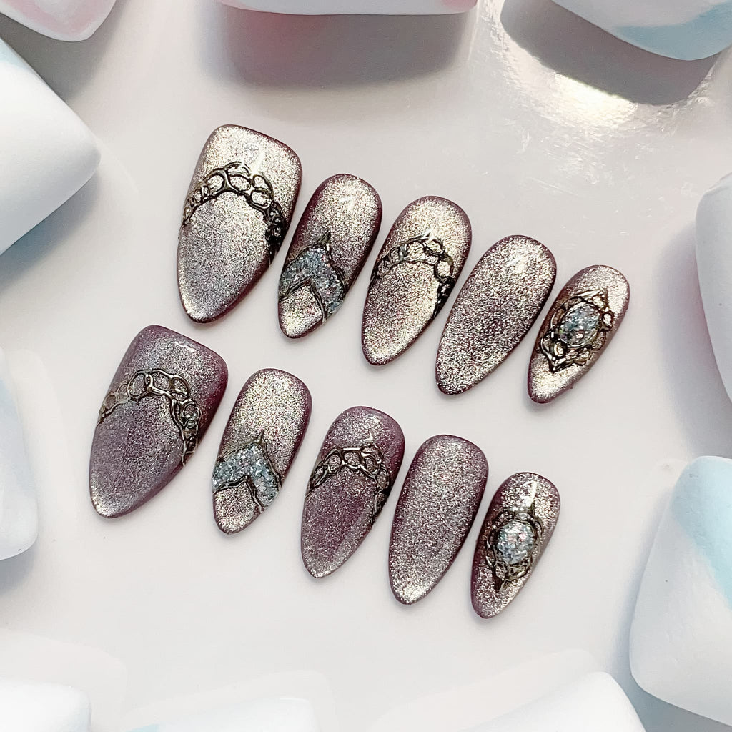 medium length lavender almond press on nails with glitter design