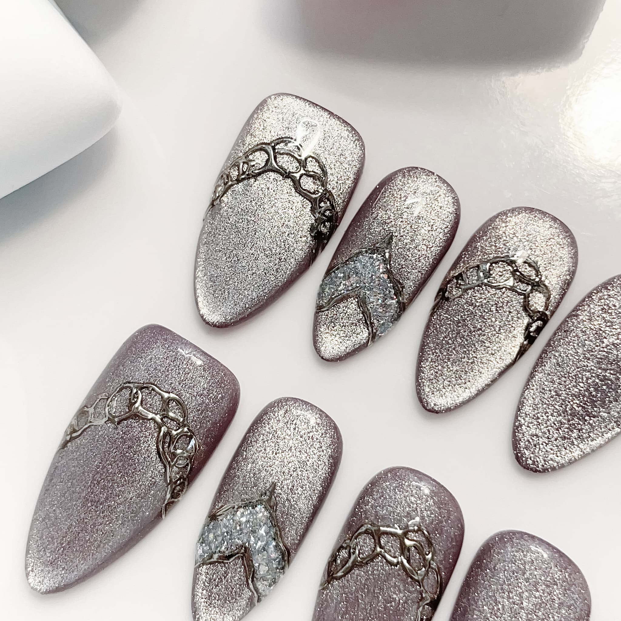medium length lavender almond press on nails with glitter design
