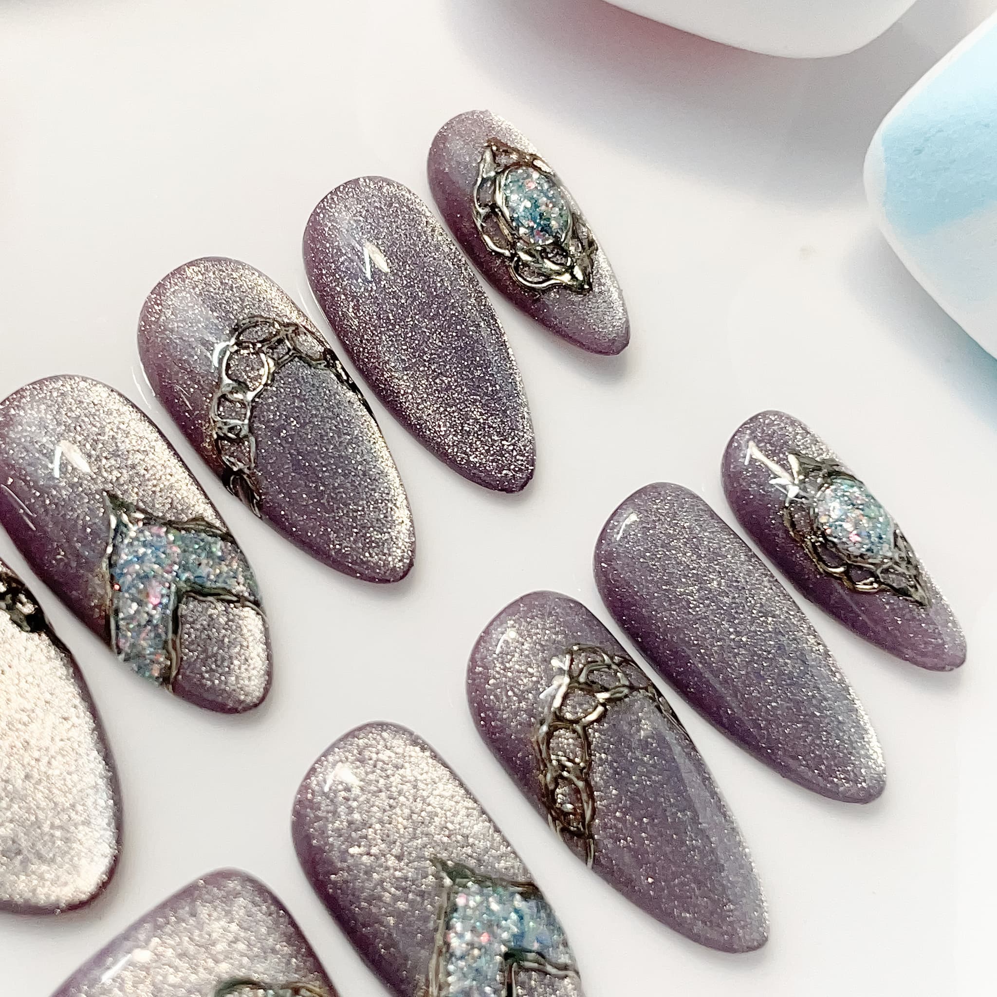 medium length lavender almond press on nails with glitter design