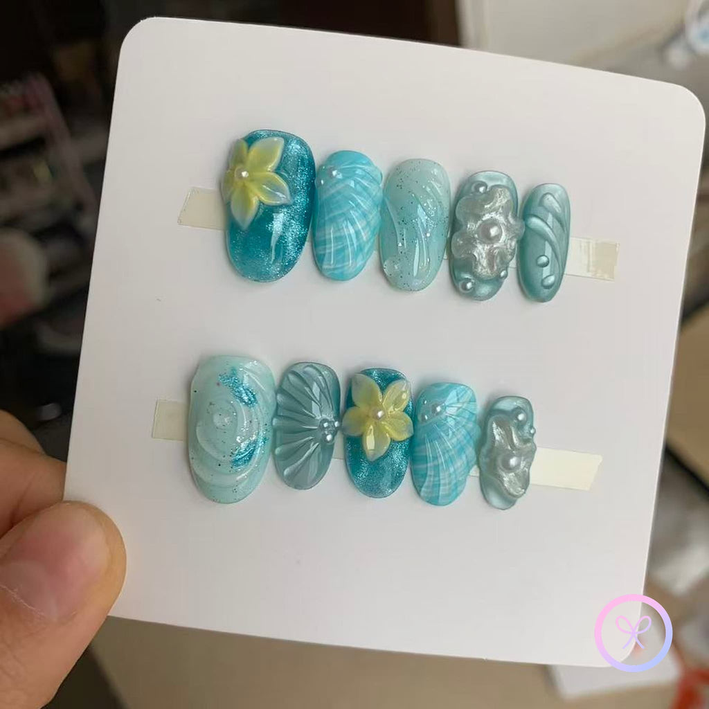oceanic blue glossy short oval press on nails with water ripple effect and embossed flowers