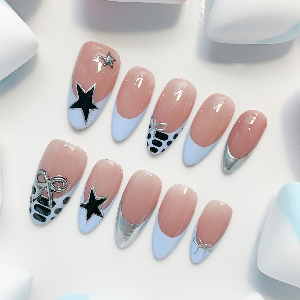 medium length skyblue almond press on nails , french tips design