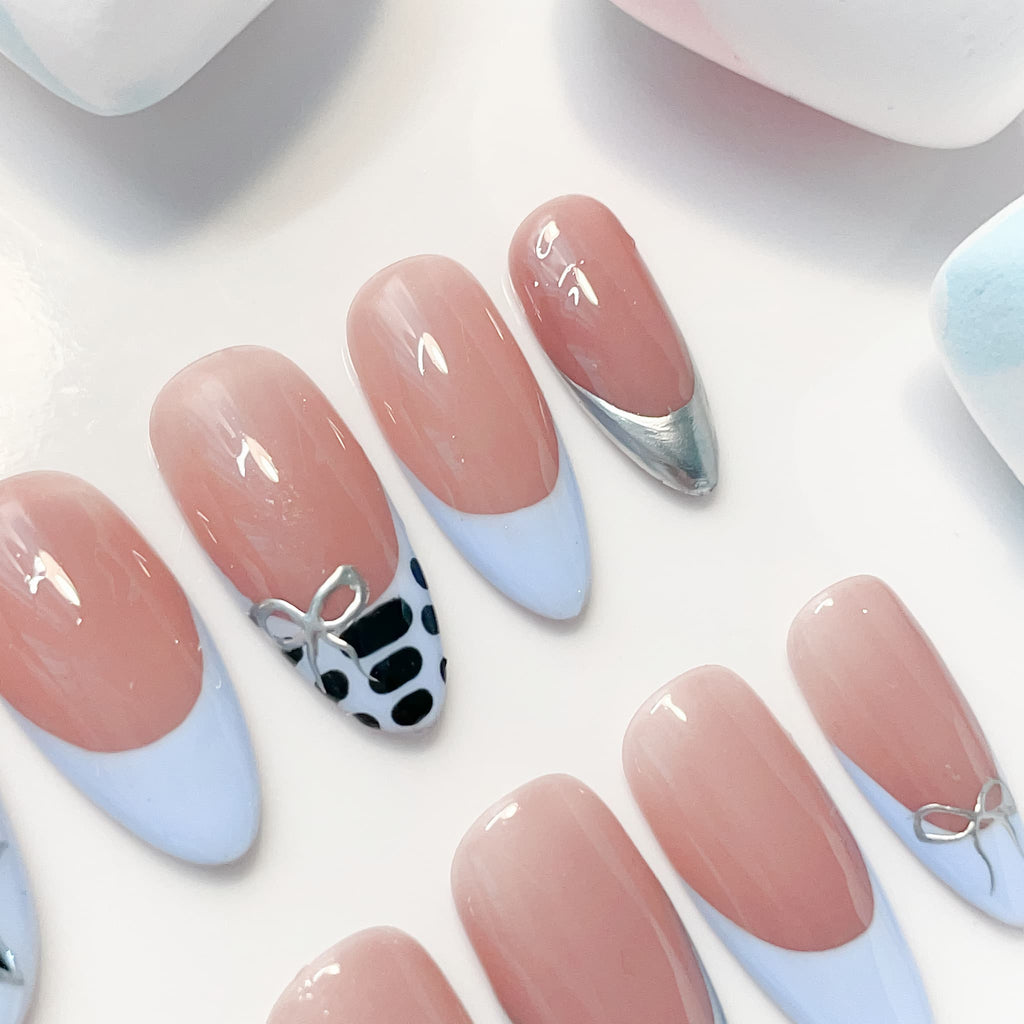 medium length skyblue almond press on nails , french tips design