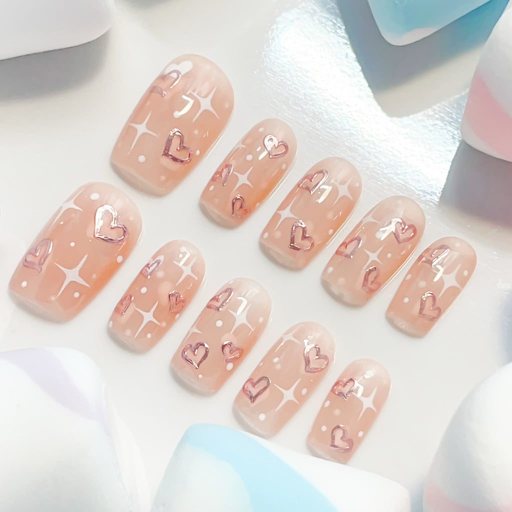 medium length peach puff square press on nails with star and heart shape patterns