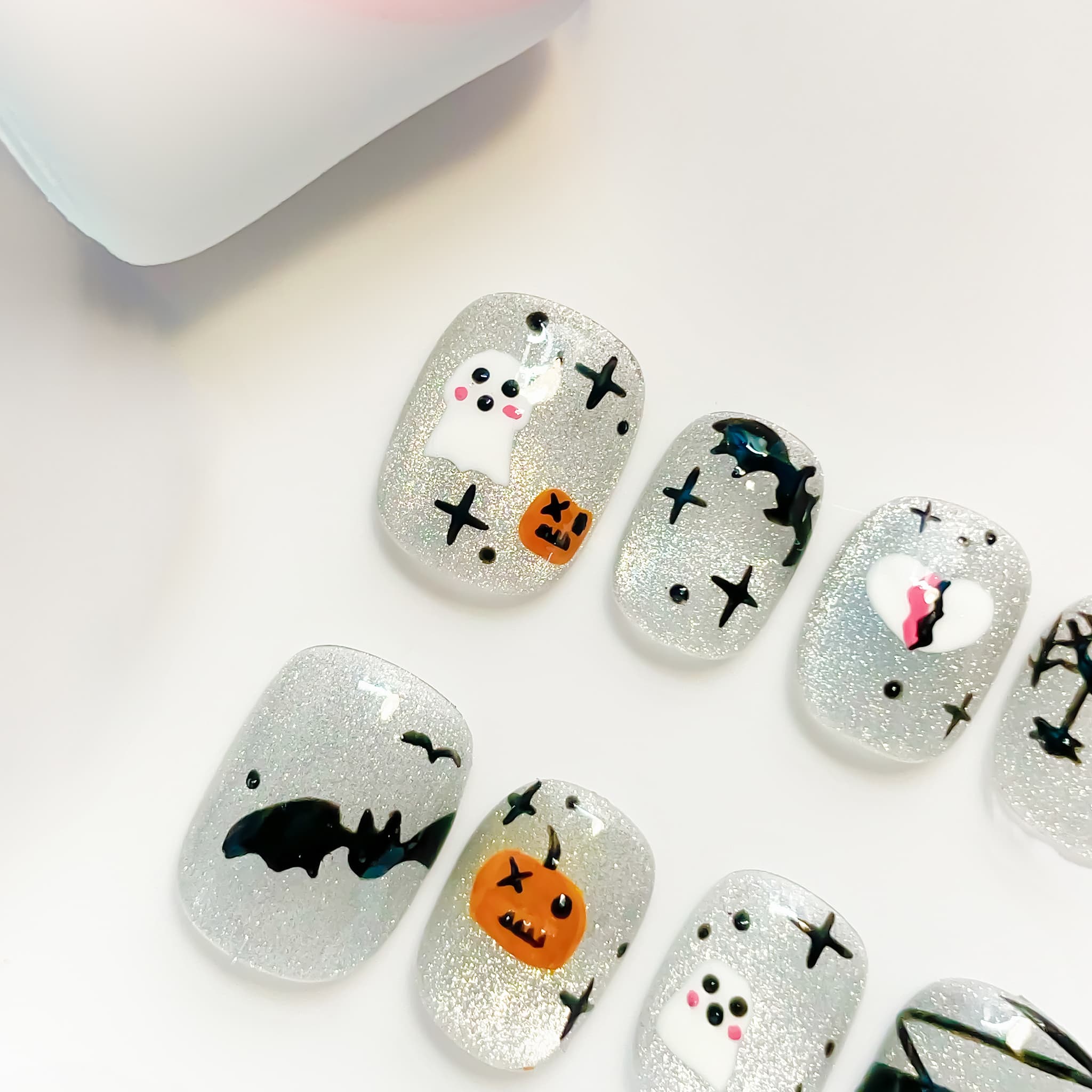 short length silver squoval press on nails with halloween design
