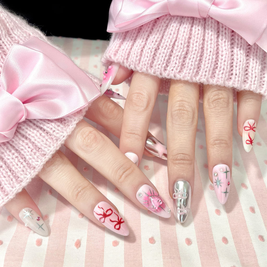 medium length light pink almond press on nails with stars and bows design