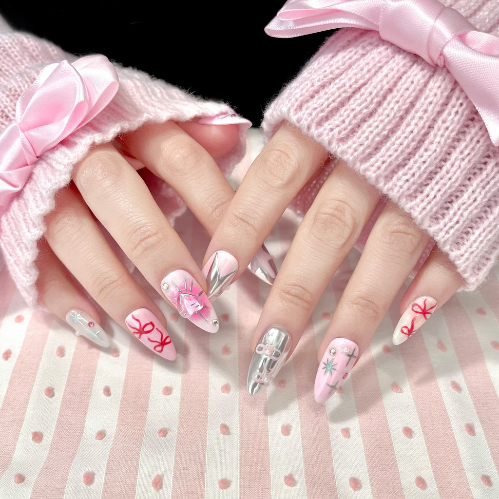 medium length light pink almond press on nails with stars and bows design