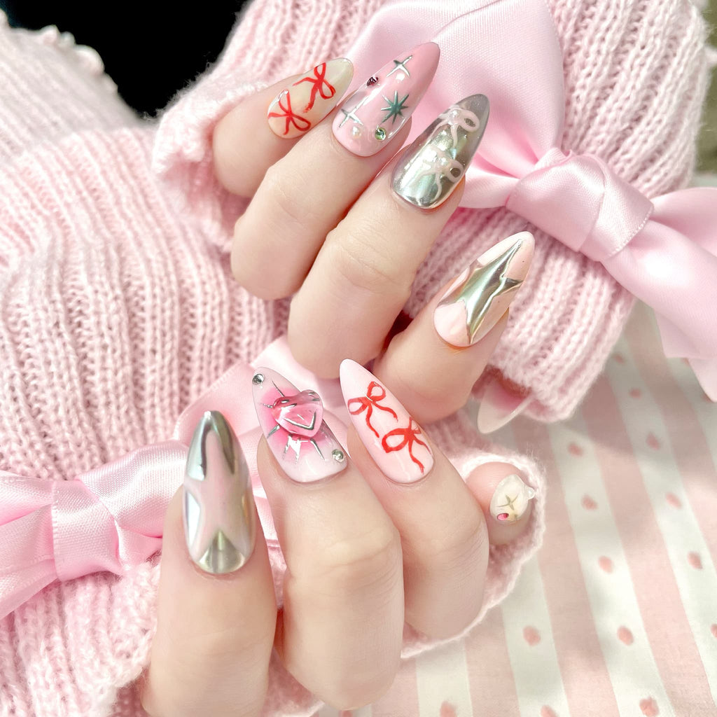 medium length light pink almond press on nails with stars and bows design