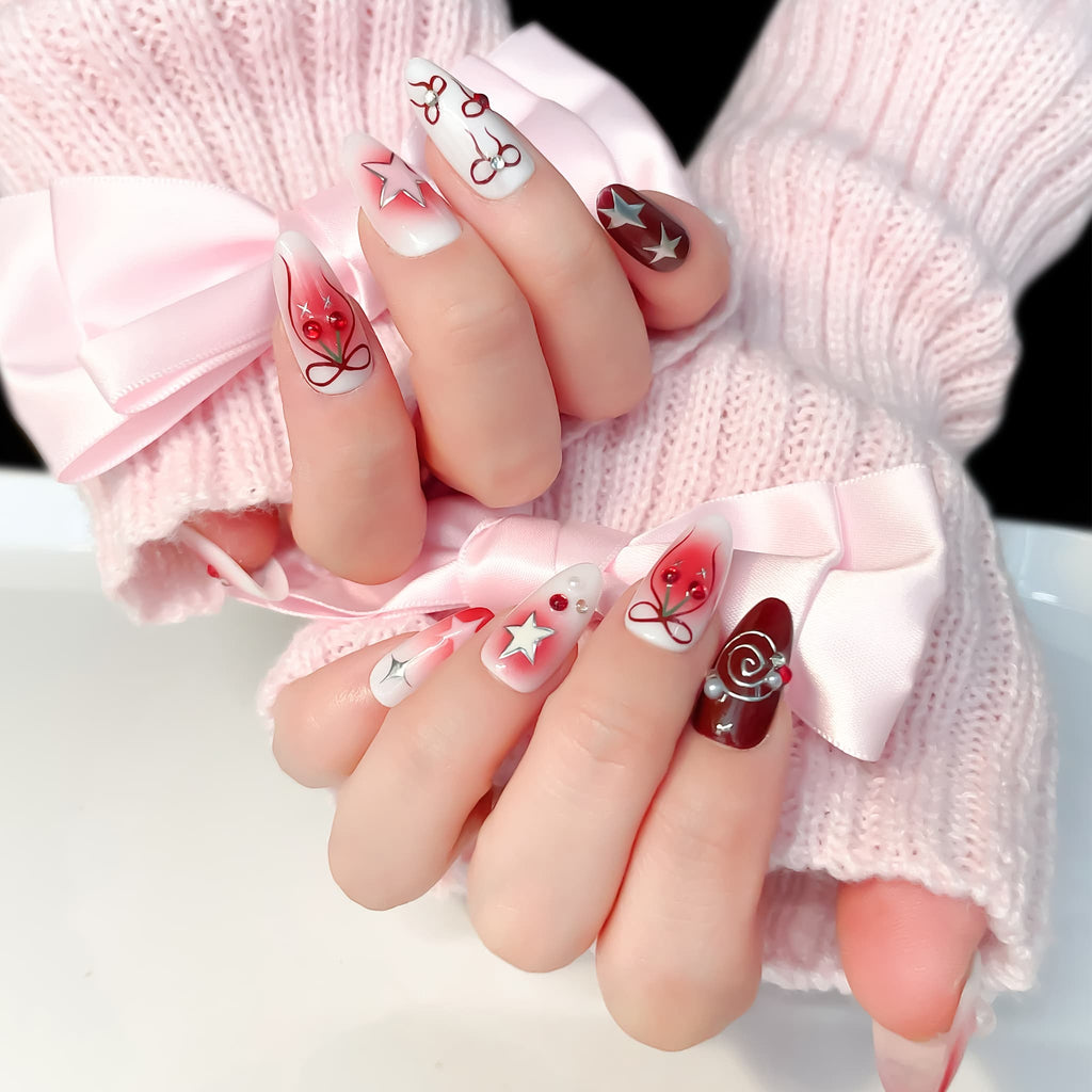 medium length crimson oval press on nails with spiral/star and cherries design