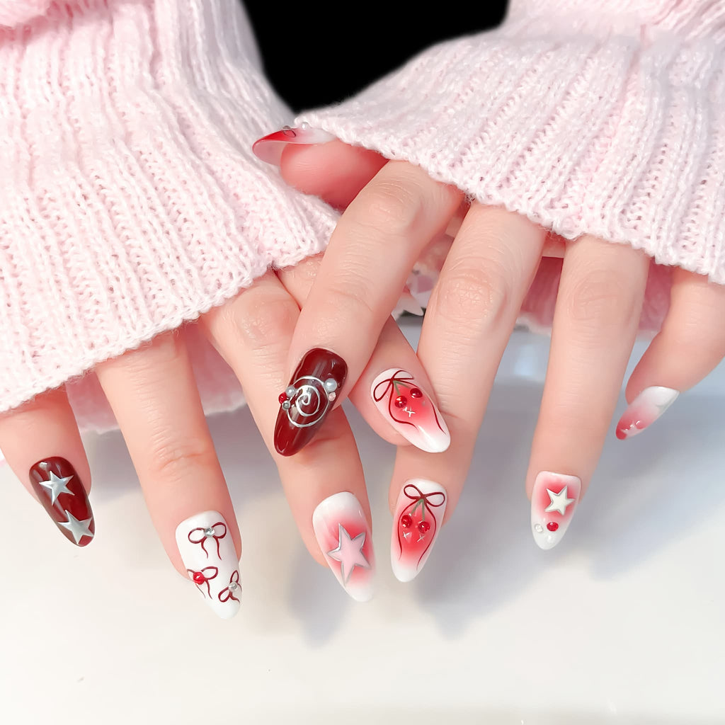 medium length crimson oval press on nails with spiral/star and cherries design