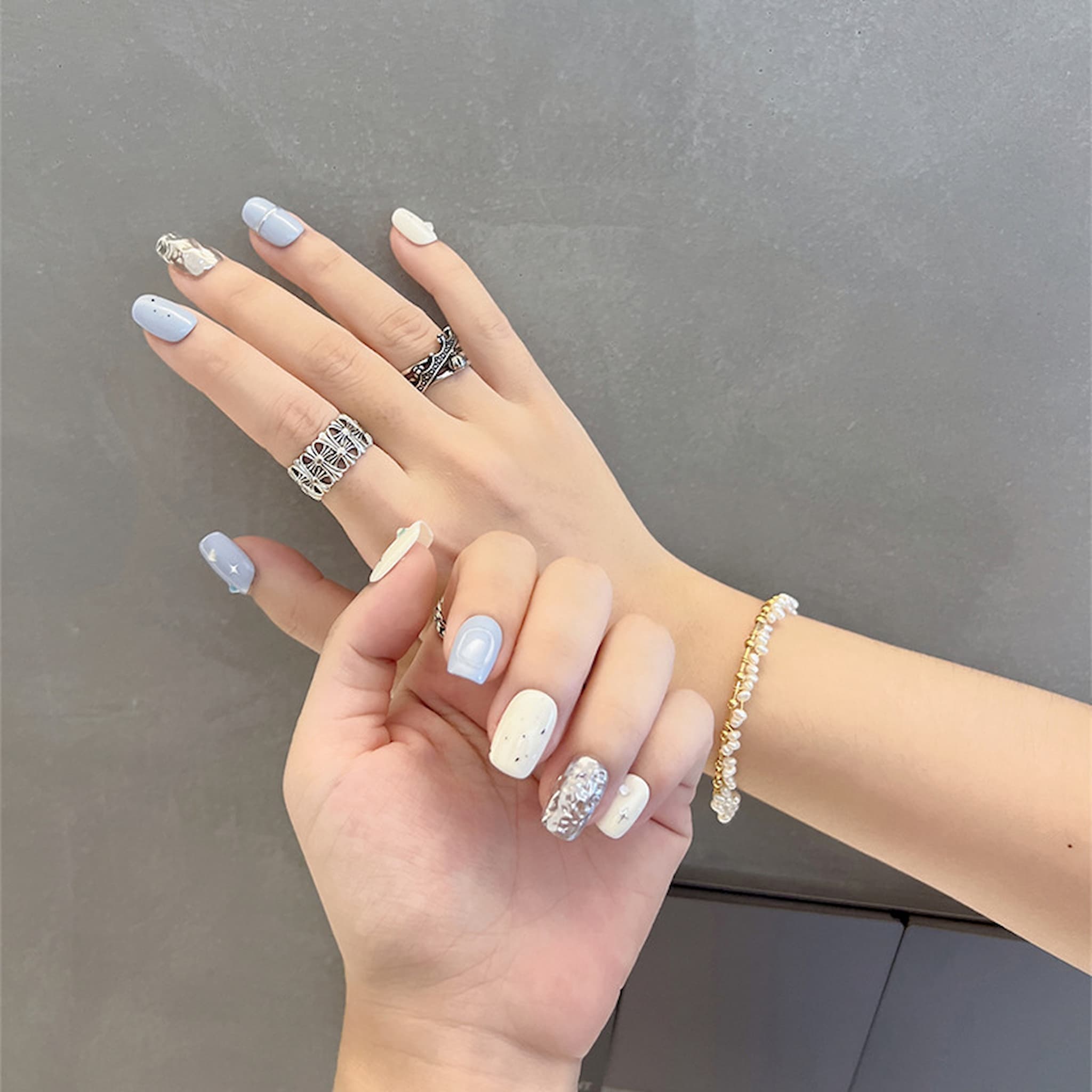 short length light blue squoval press on nails with star patterns