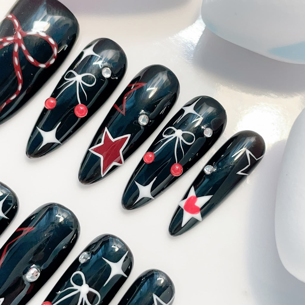 long length black oval press on nails with bow design