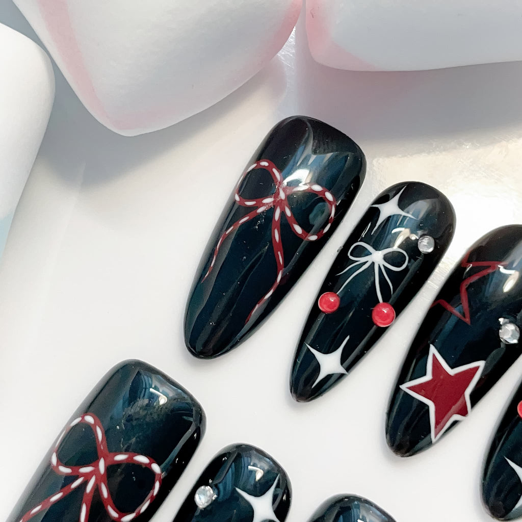 long length black oval press on nails with bow design