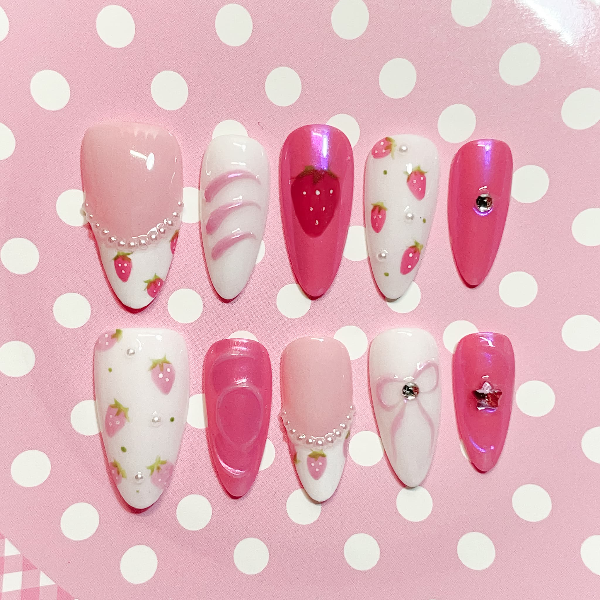 medium length pink almond press on nails with strawberry design