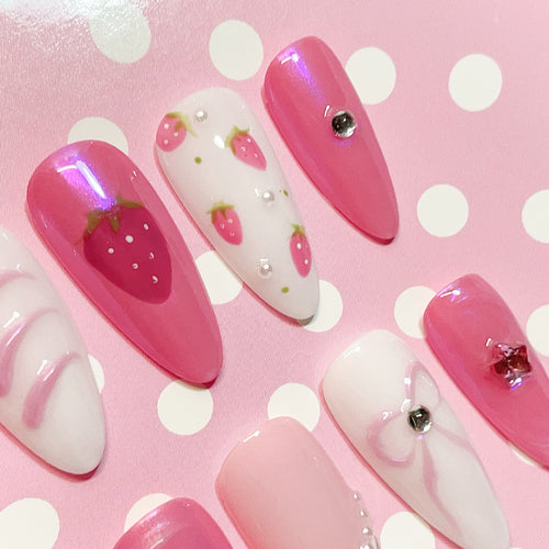 medium length pink almond press on nails with strawberry design