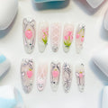 long length light pink oval press on nails with strawberry/lace and bow design