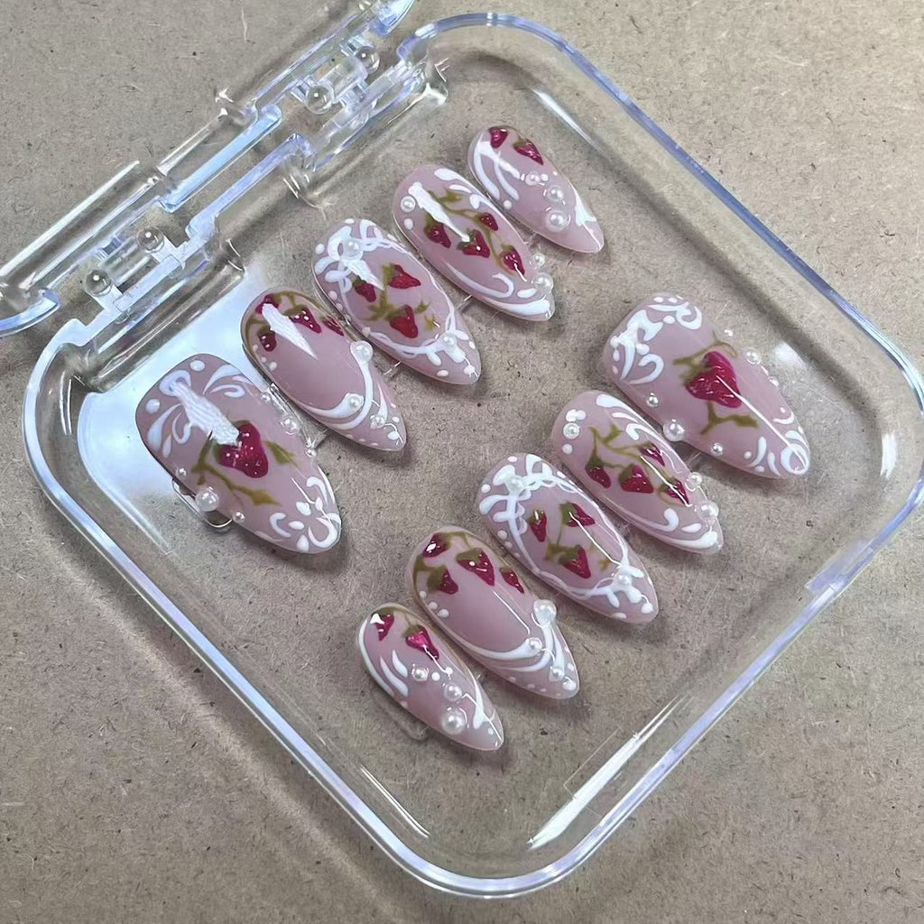 medium length red almond press on nails with strawberry design