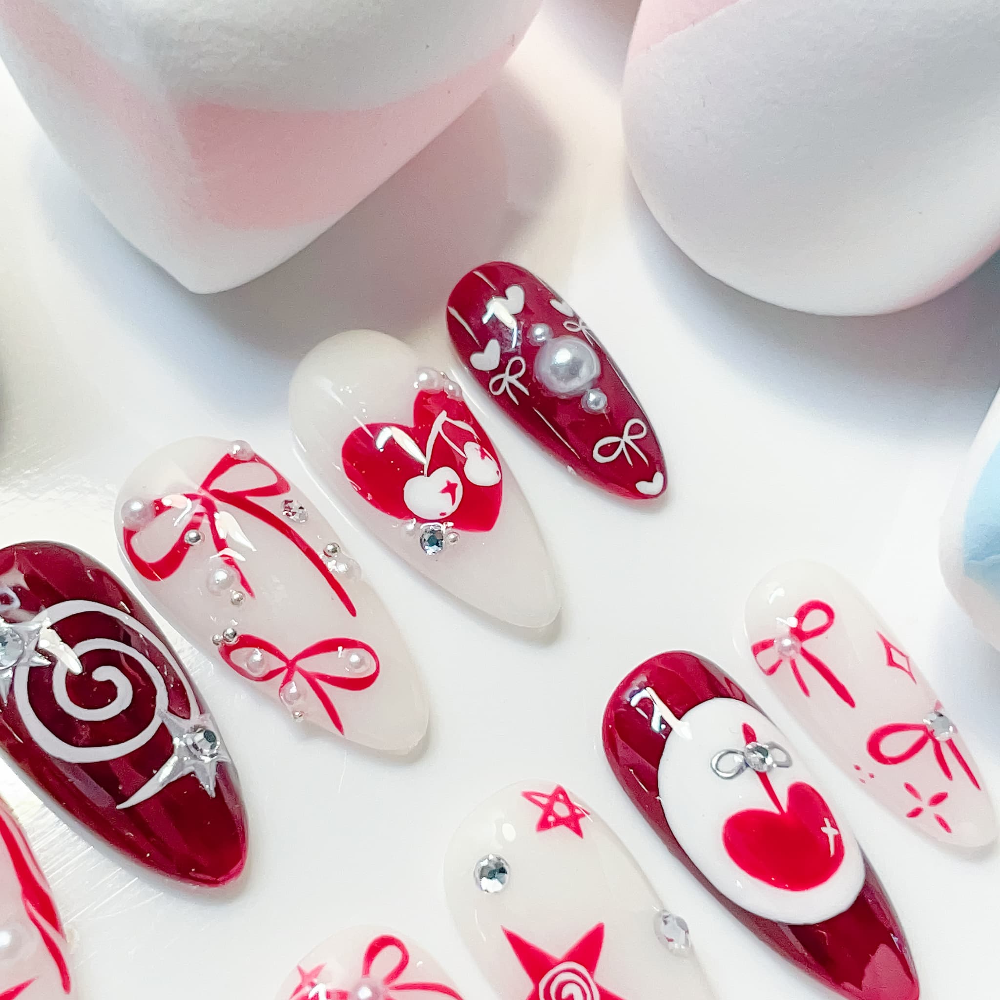 medium length crimson almond press on nails with cherry design