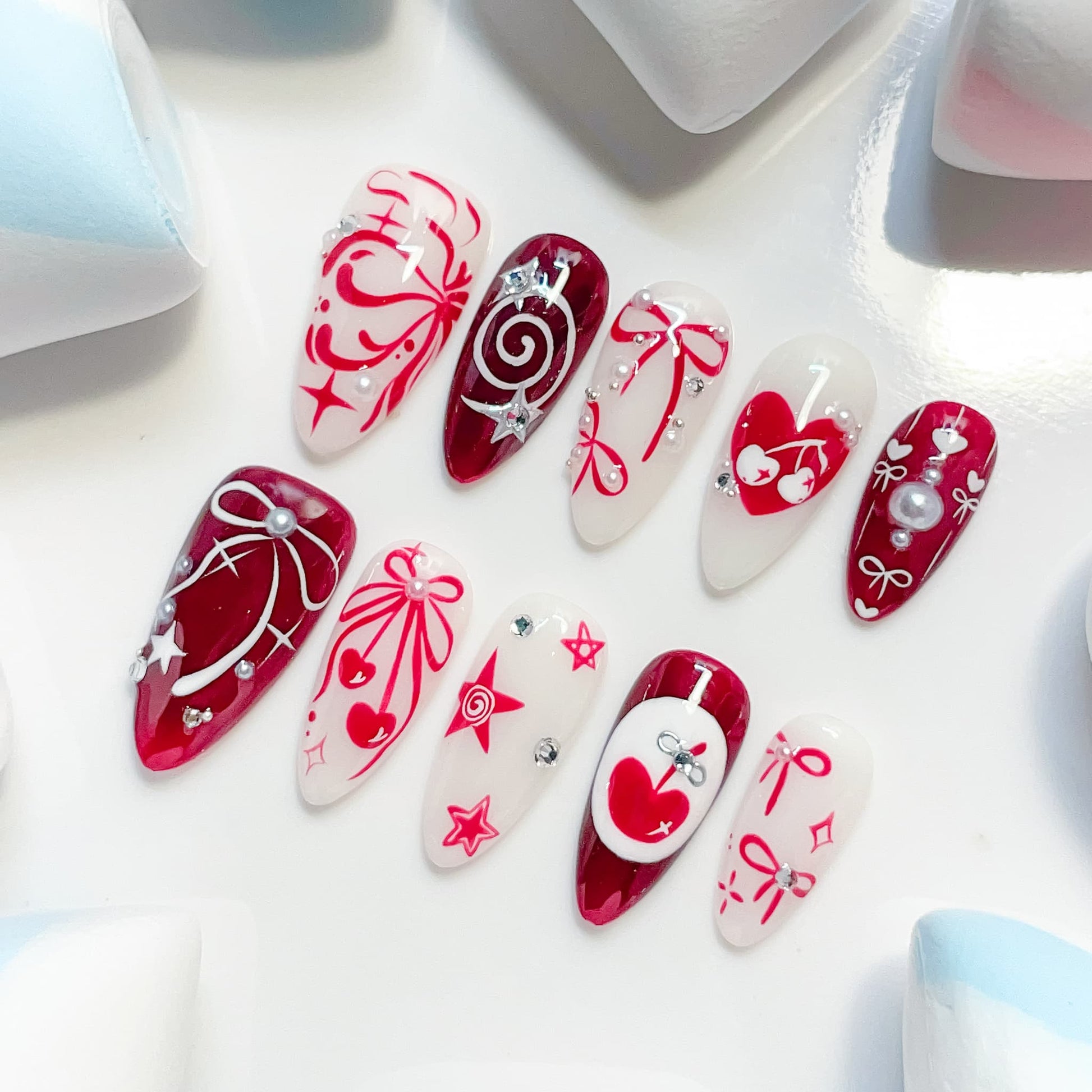 medium length crimson almond press on nails with cherry design