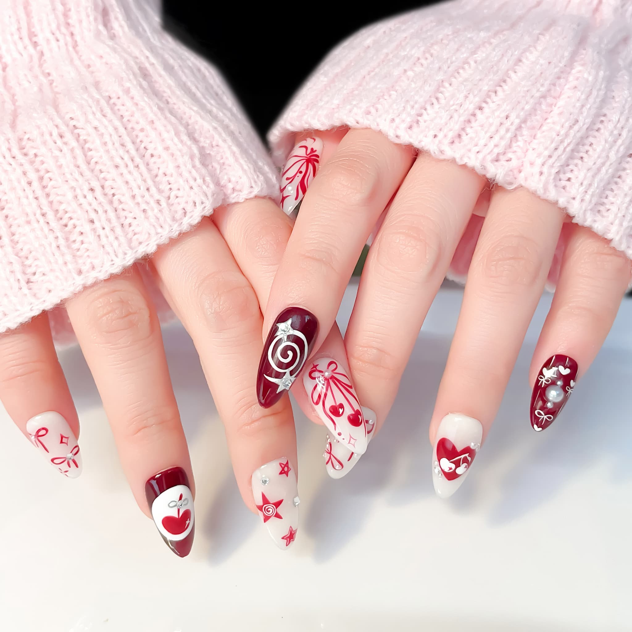 medium length crimson almond press on nails with cherry design
