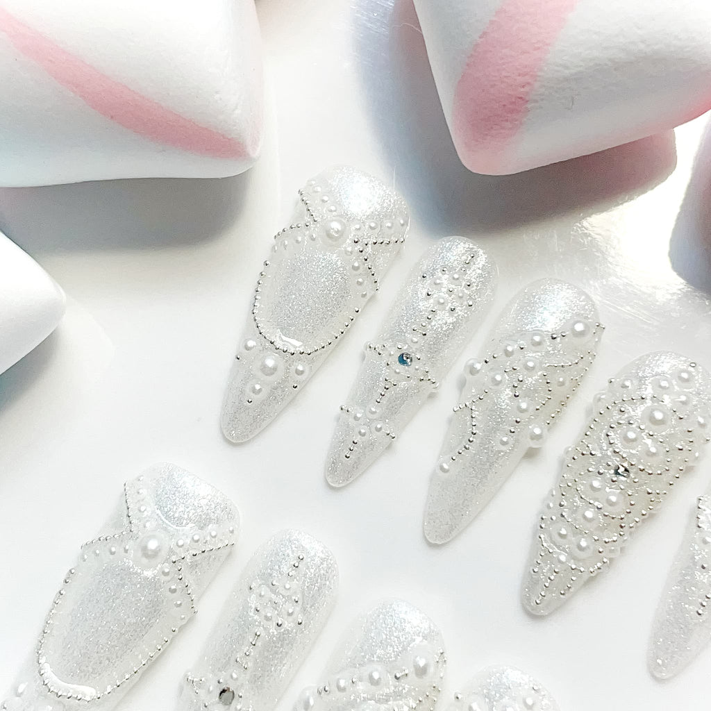 long length white stiletto press on nails with pearl design