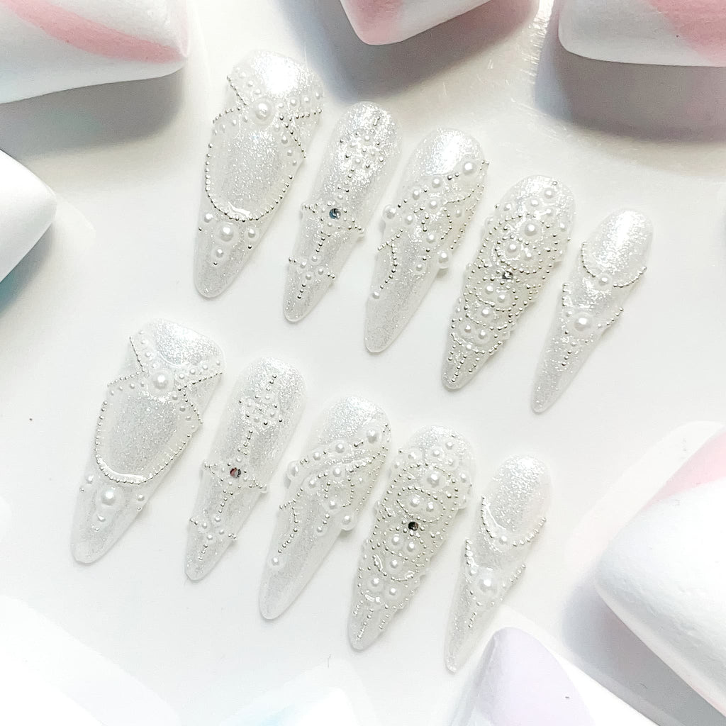 long length white stiletto press on nails with pearl design