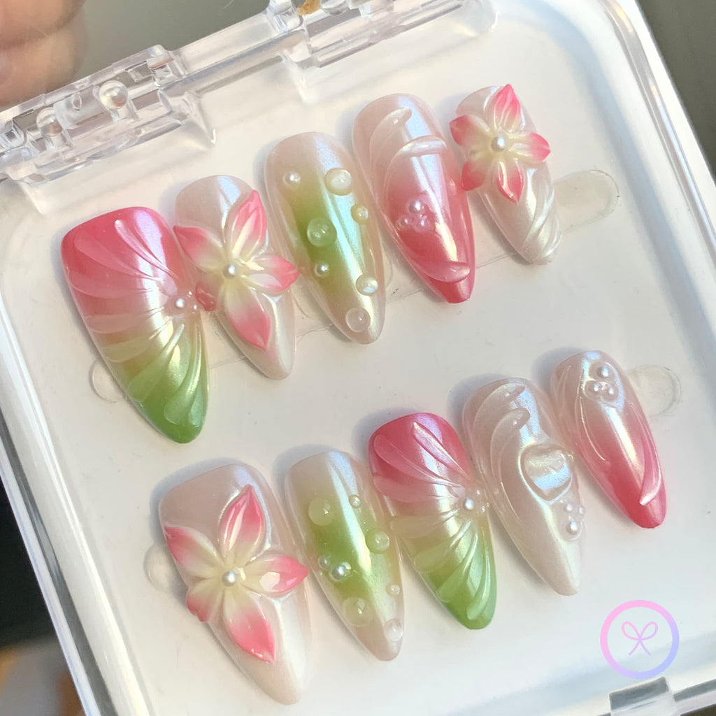 elegant pink iridescent medium almond press on nails with embossed flowers and water droplets and swirls