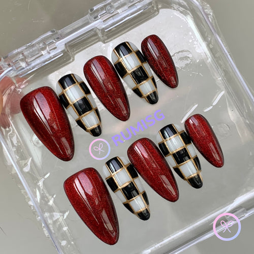 royalcore red glossy medium almond press on nails with checkerboard and gold lines