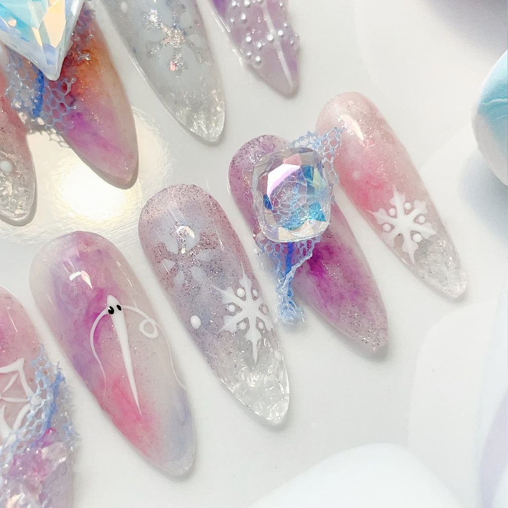 long length lavender almond press on nails with snowflakes design