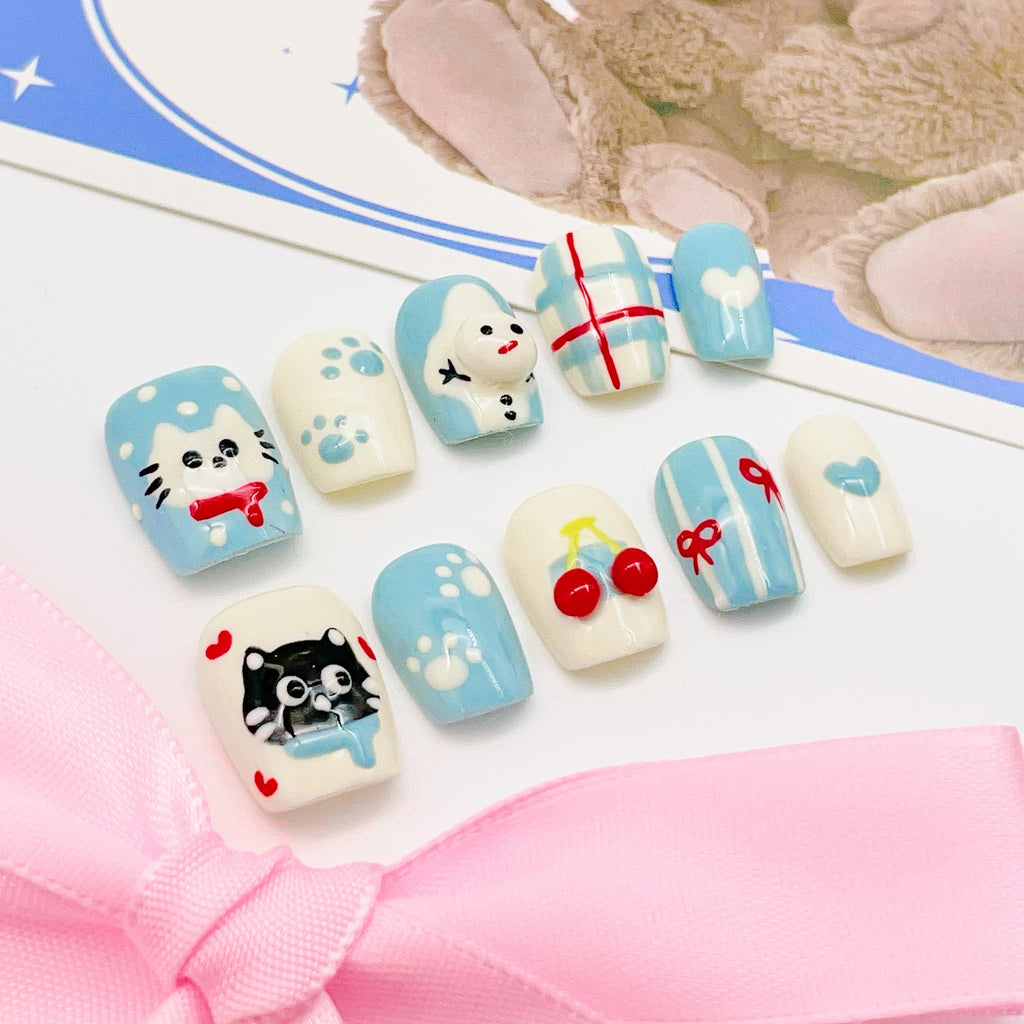 short length light blue squoval press on nails with cat design, winter season design