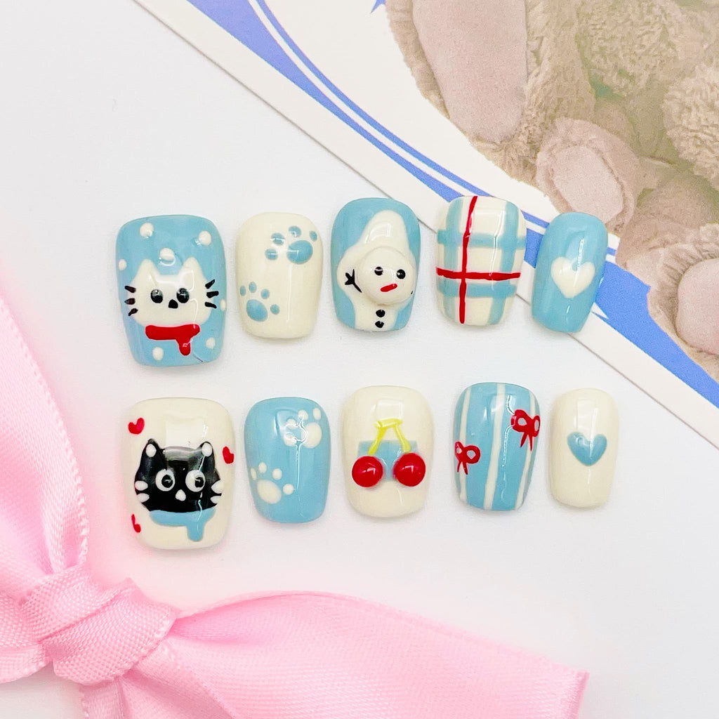 short length light blue squoval press on nails with cat design, winter season design
