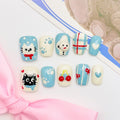 short length light blue squoval press on nails with cat design, winter season design