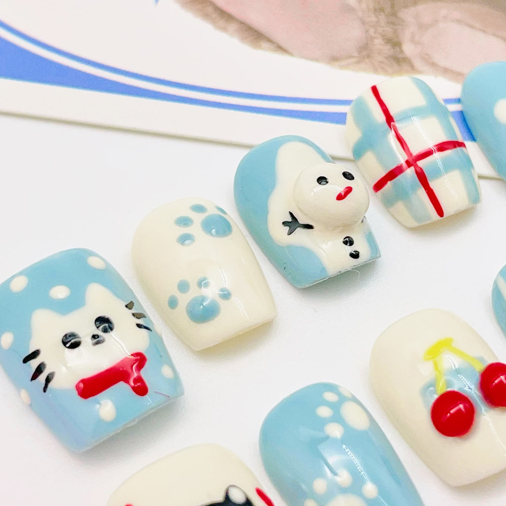 short length light blue squoval press on nails with cat design, winter season design