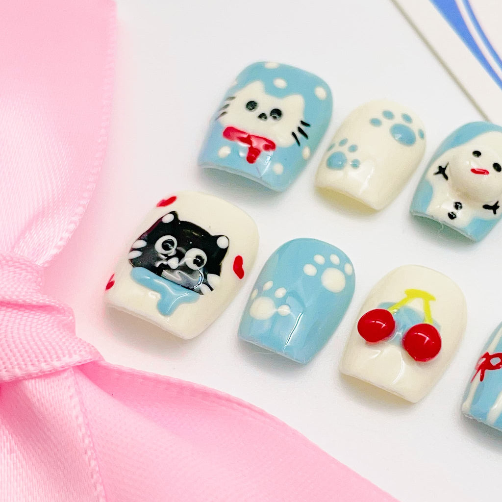 short length light blue squoval press on nails with cat design, winter season design
